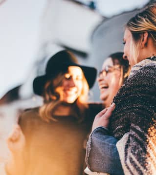 a group of women smiling