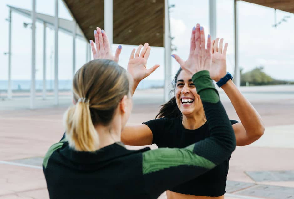 a group of women giving each other high five