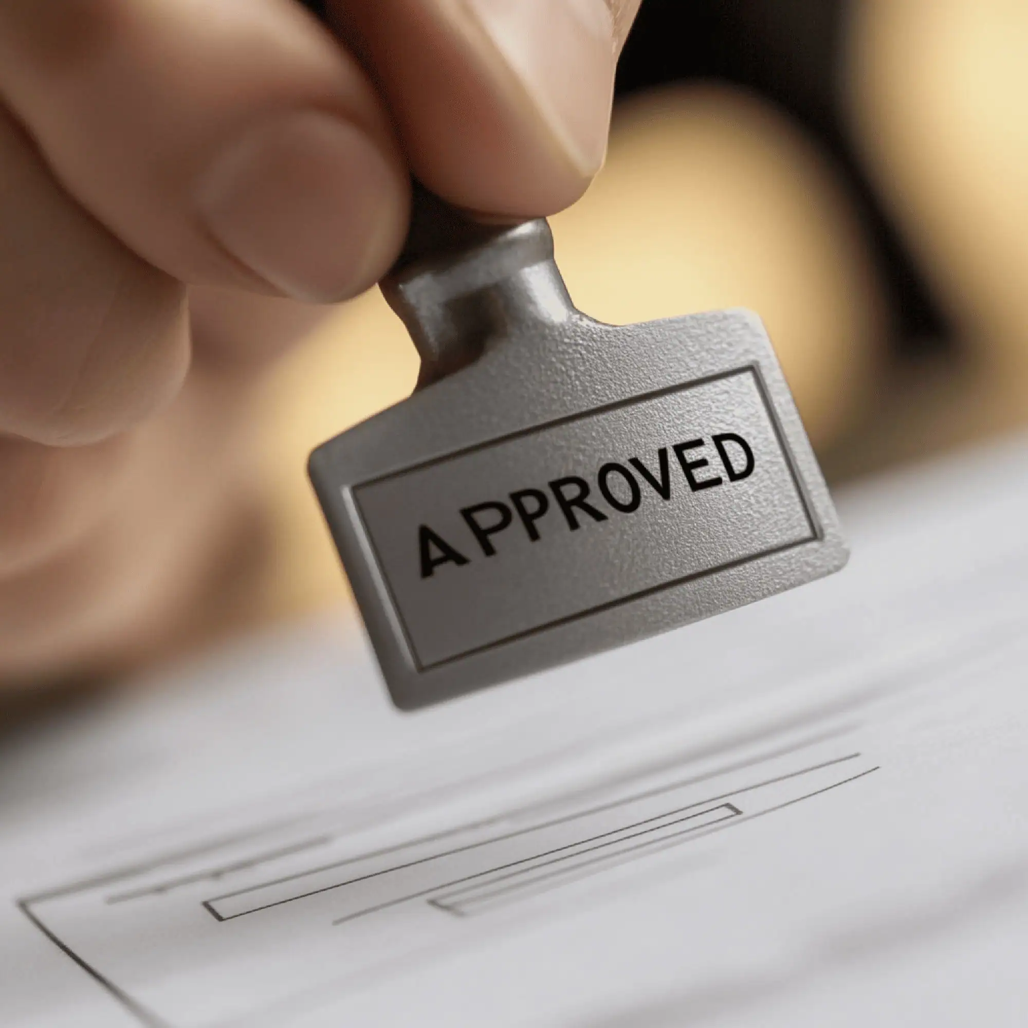 Approved stamp on a document symbolizing authorization and validation.