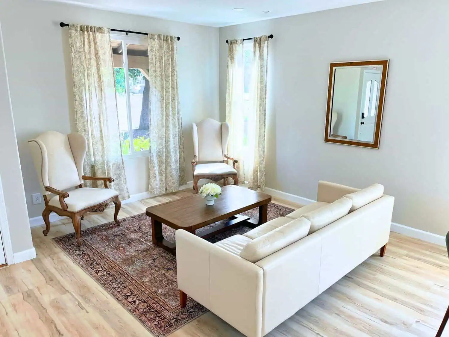 Bright and cozy living room with elegant furniture and natural light.