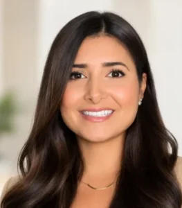 Smiling woman with long dark hair representing Sol Women's Treatment team.