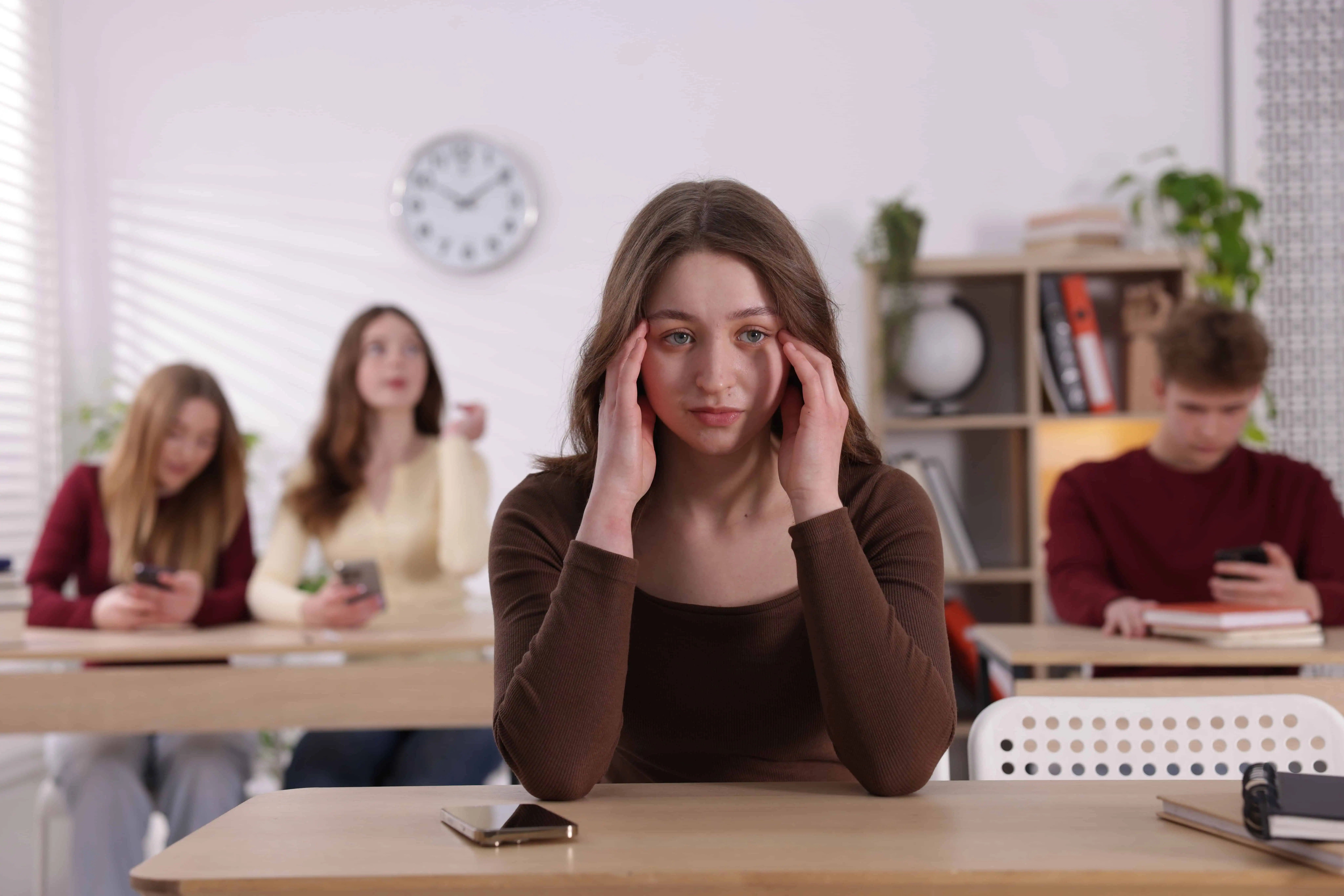 First-generation college student under stress in a classroom