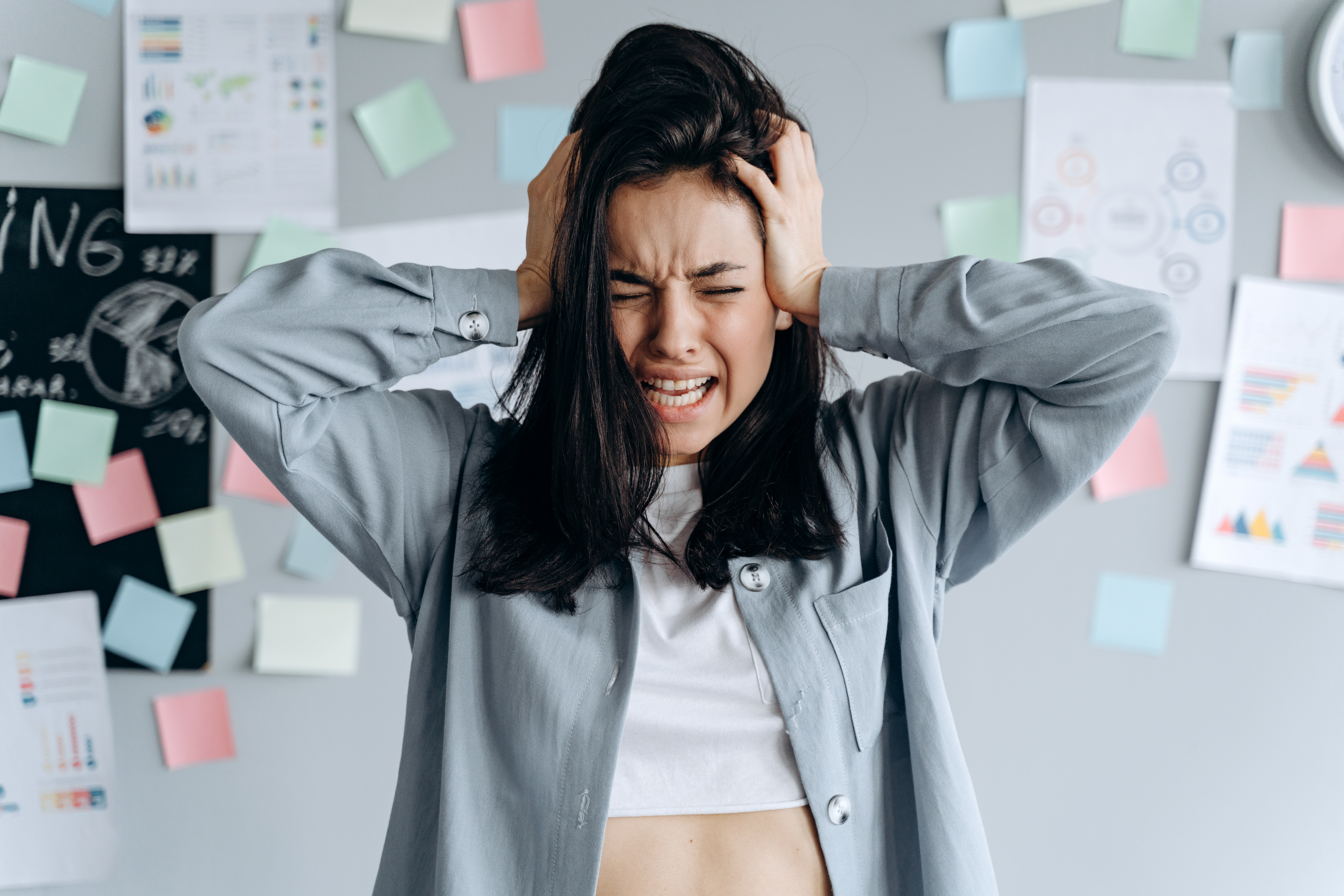 College woman experiencing academic burnout at her desk