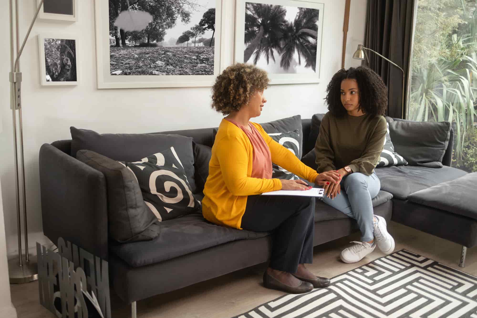 A woman meeting with a female therapist during a gentle first counseling session